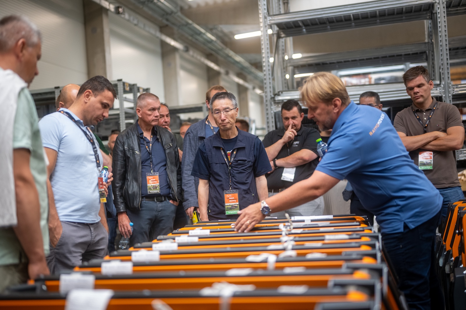 Specialist explaining battery packs to distributors