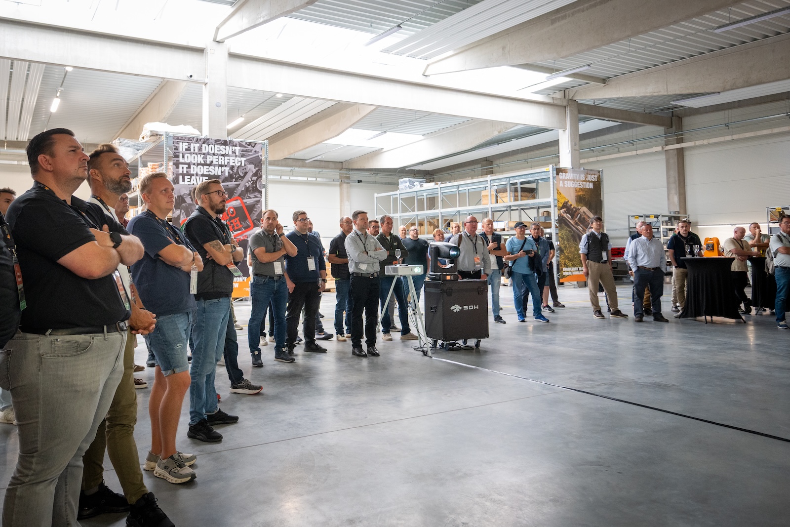 Attendees listening to a presentation inside the production hall