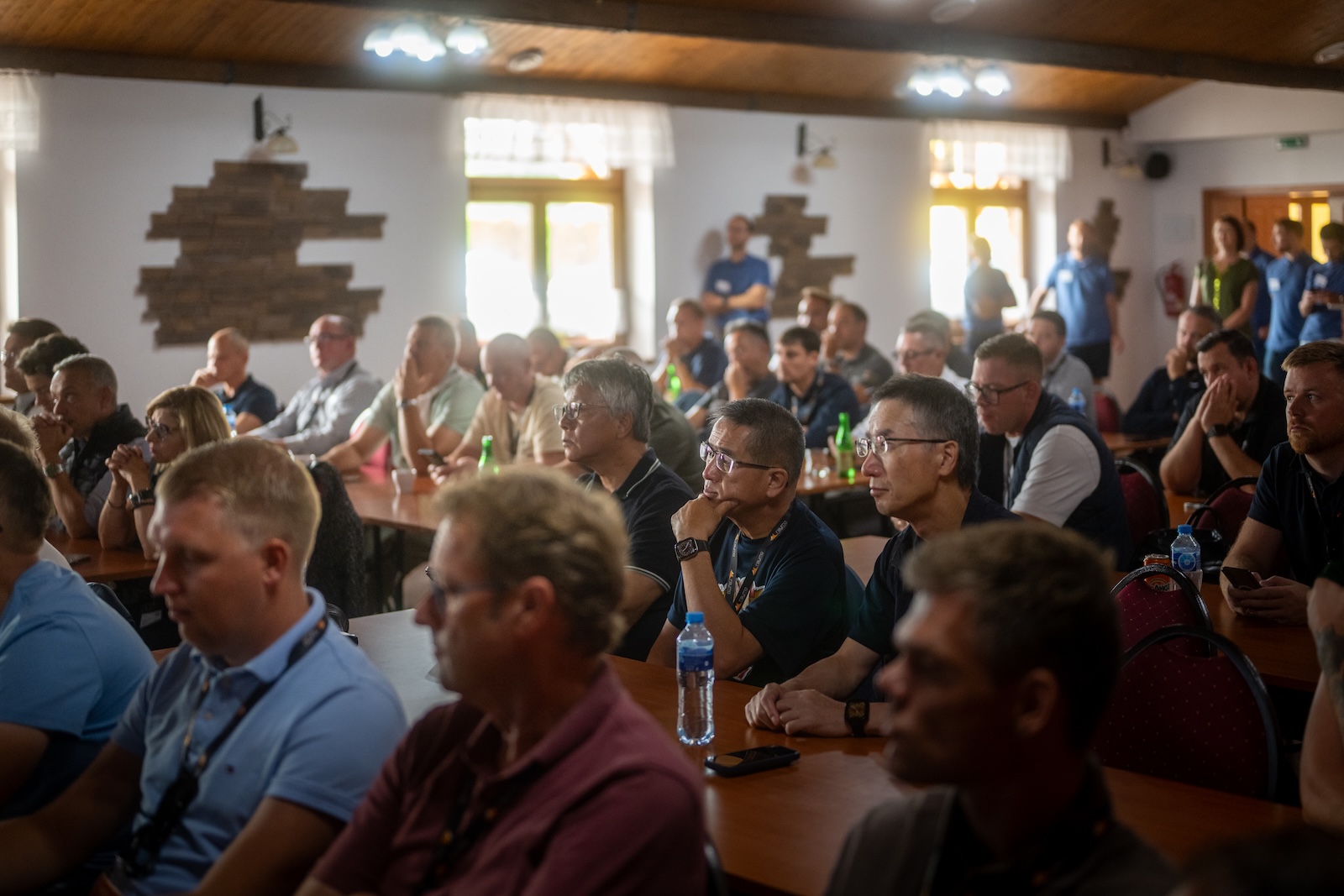 Full room of attendees watching the presentation