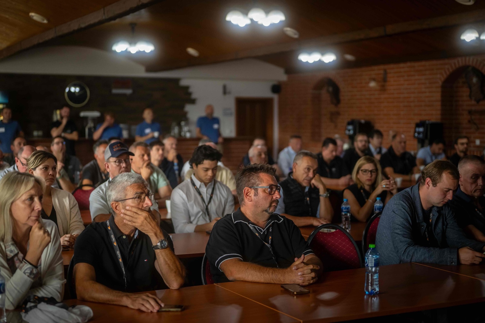 Distributors listening to a session in the hotel conference room