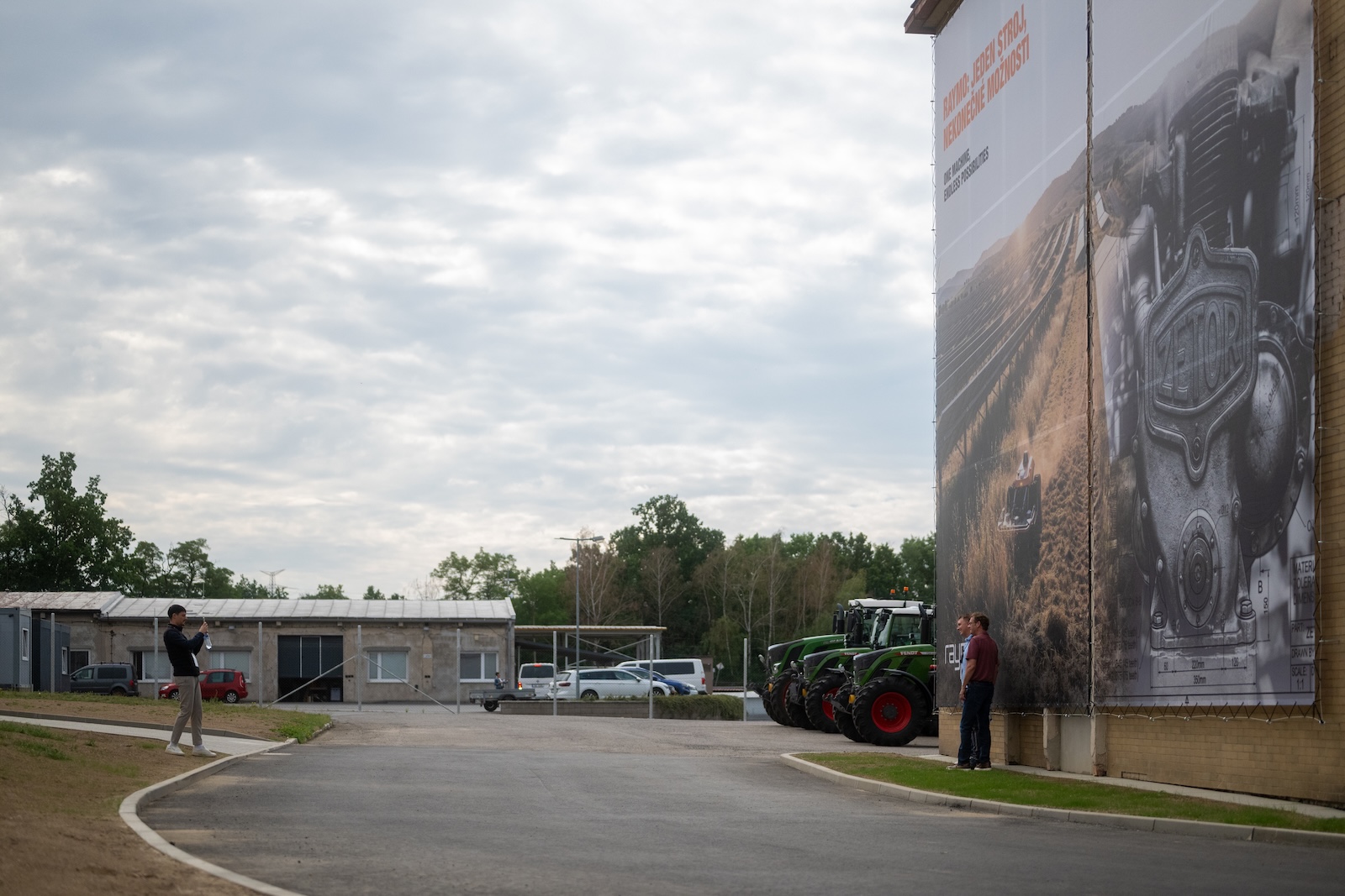 Raymo HQ yard with tractors and a large printed banner