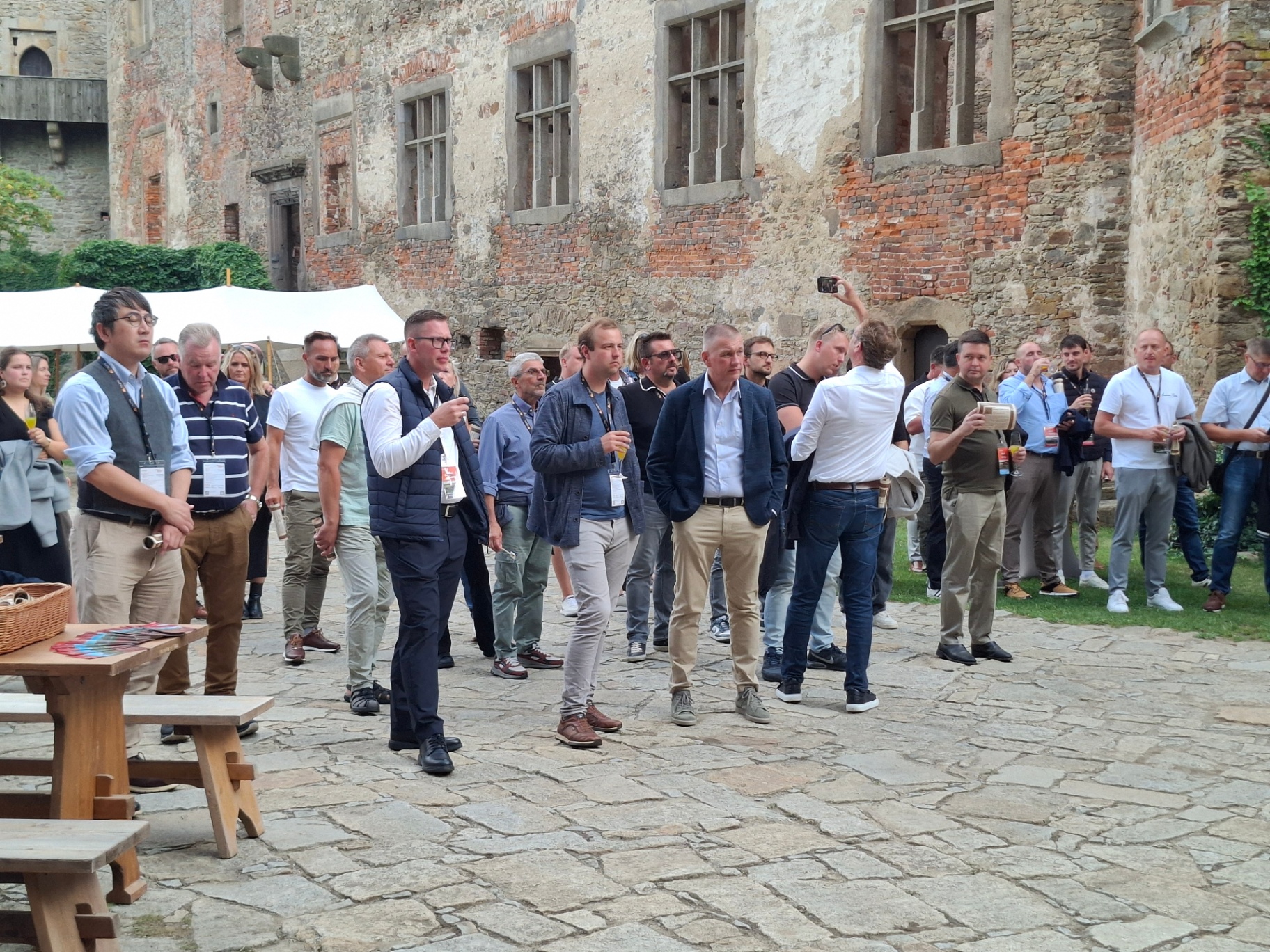 Distributors arriving in the castle courtyard with welcome drinks