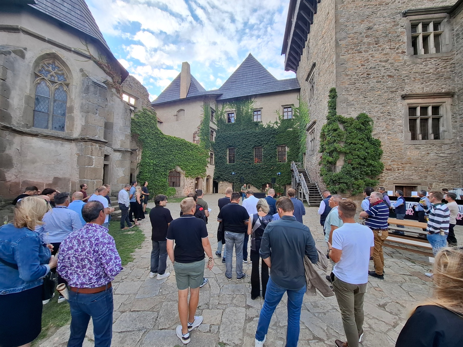 Group of attendees walking through the castle courtyard