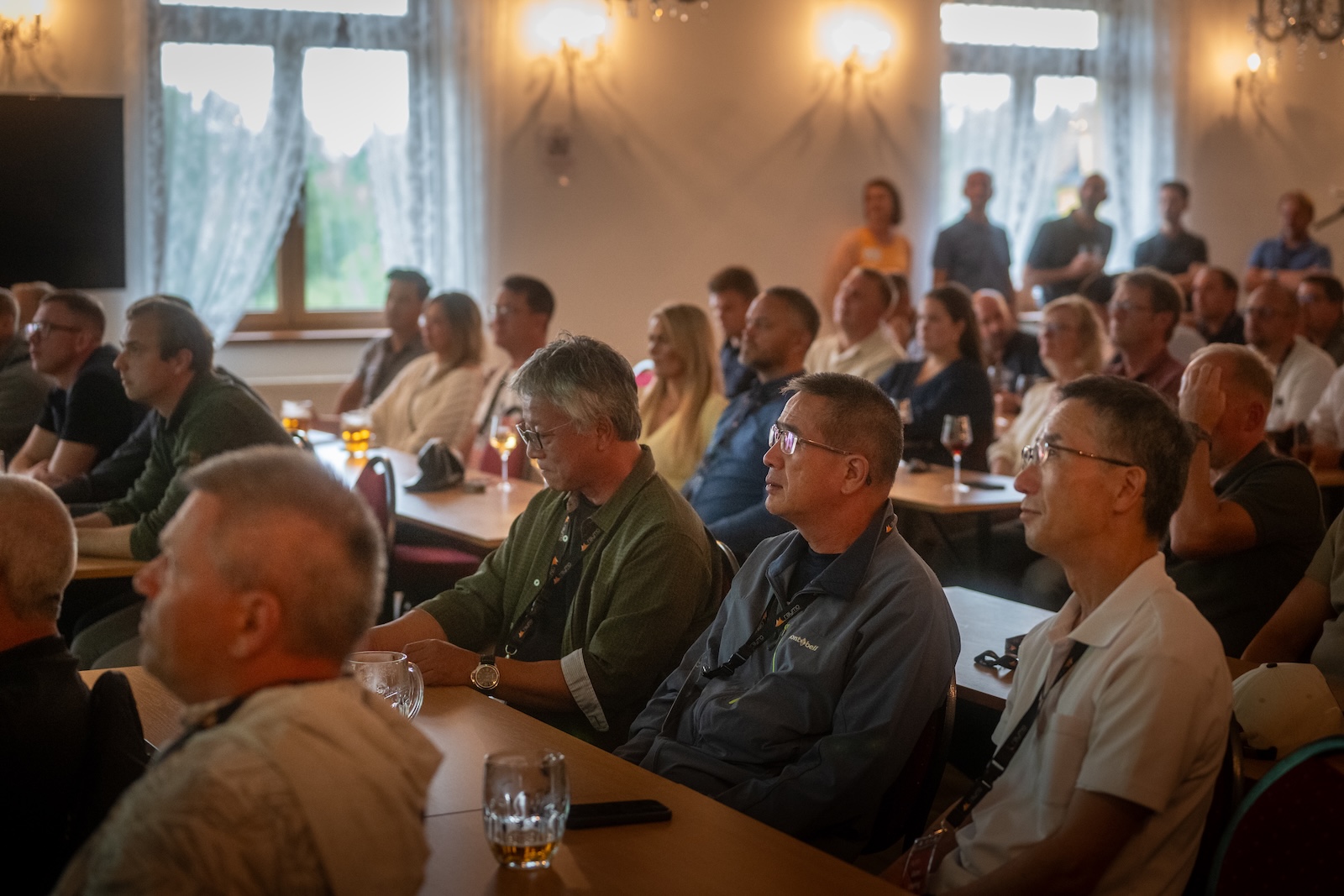 Distributors seated in the hotel conference room during a presentation