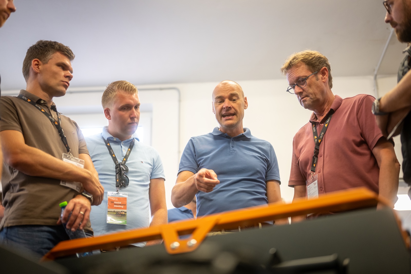 Raymo specialist explaining machine details to a small group