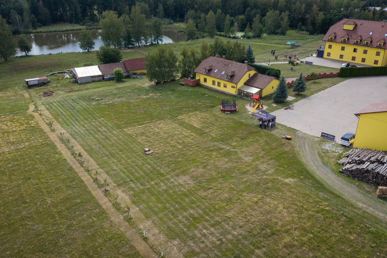 Aerial view of the hotel grounds with a Raymo mower working the meadow