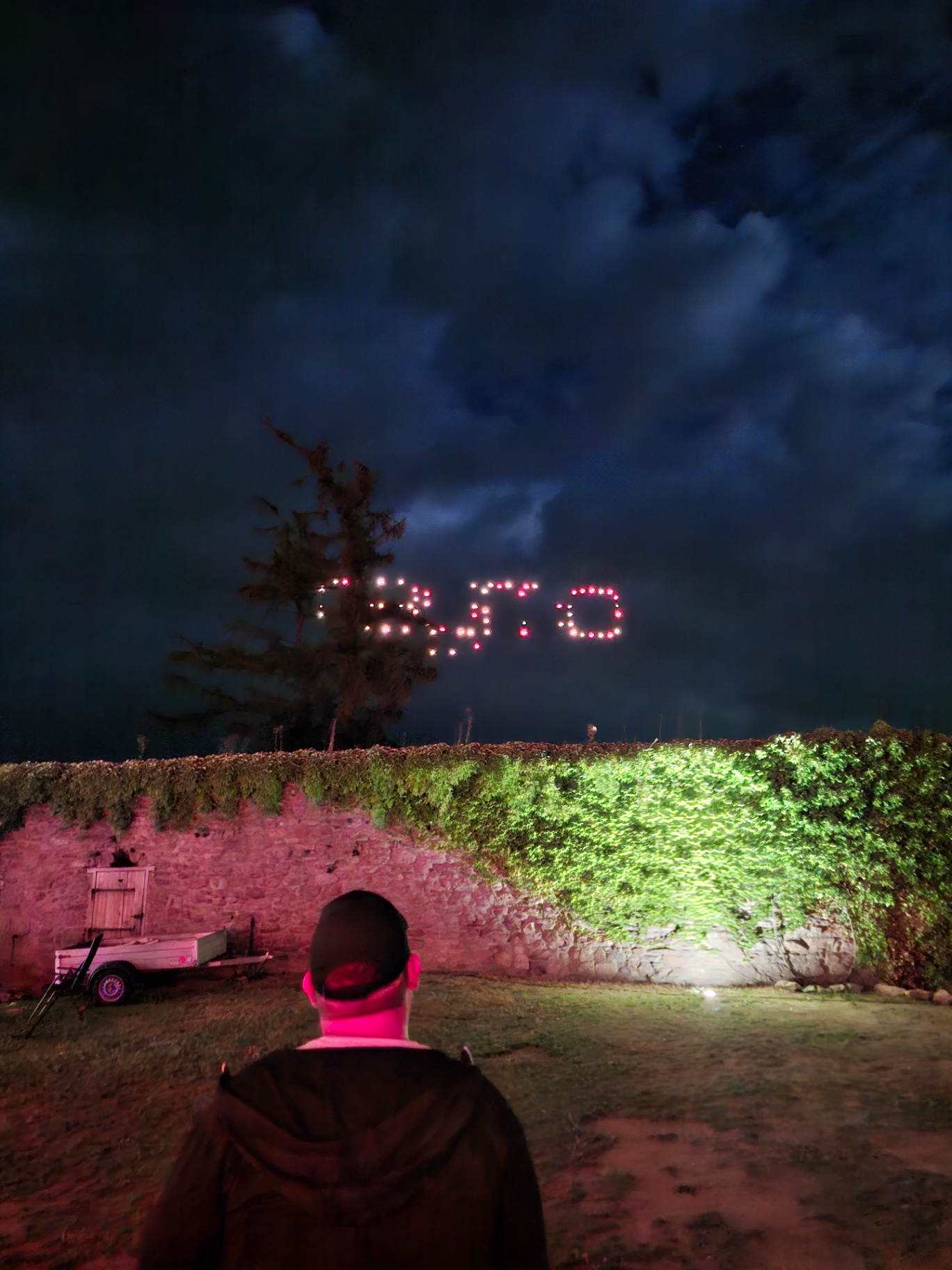 Drone light show spelling Raymo above the castle walls