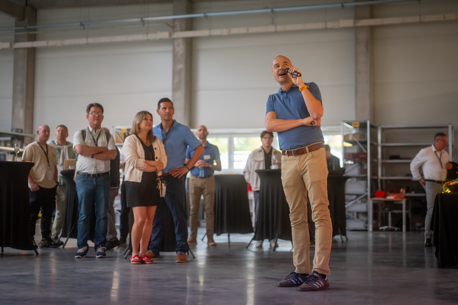Presenter speaking to guests in the new production hall