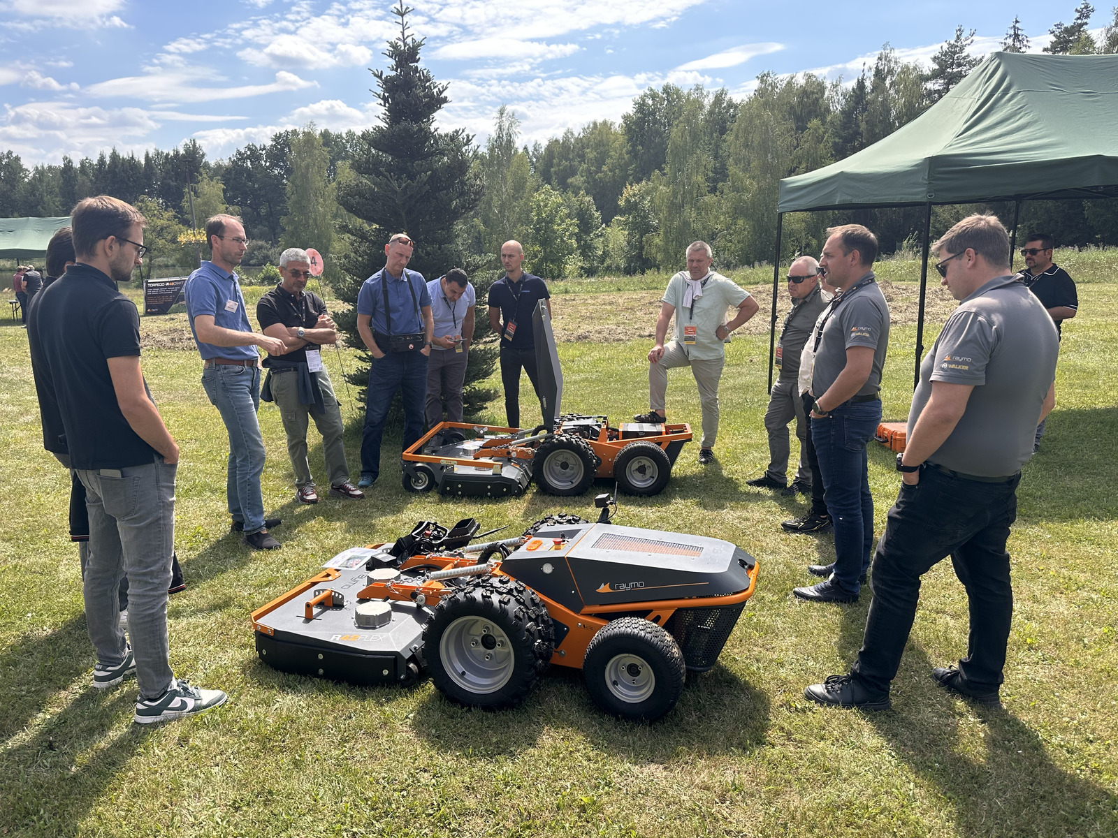 Group listening to a presenter next to the R42FLEX mower