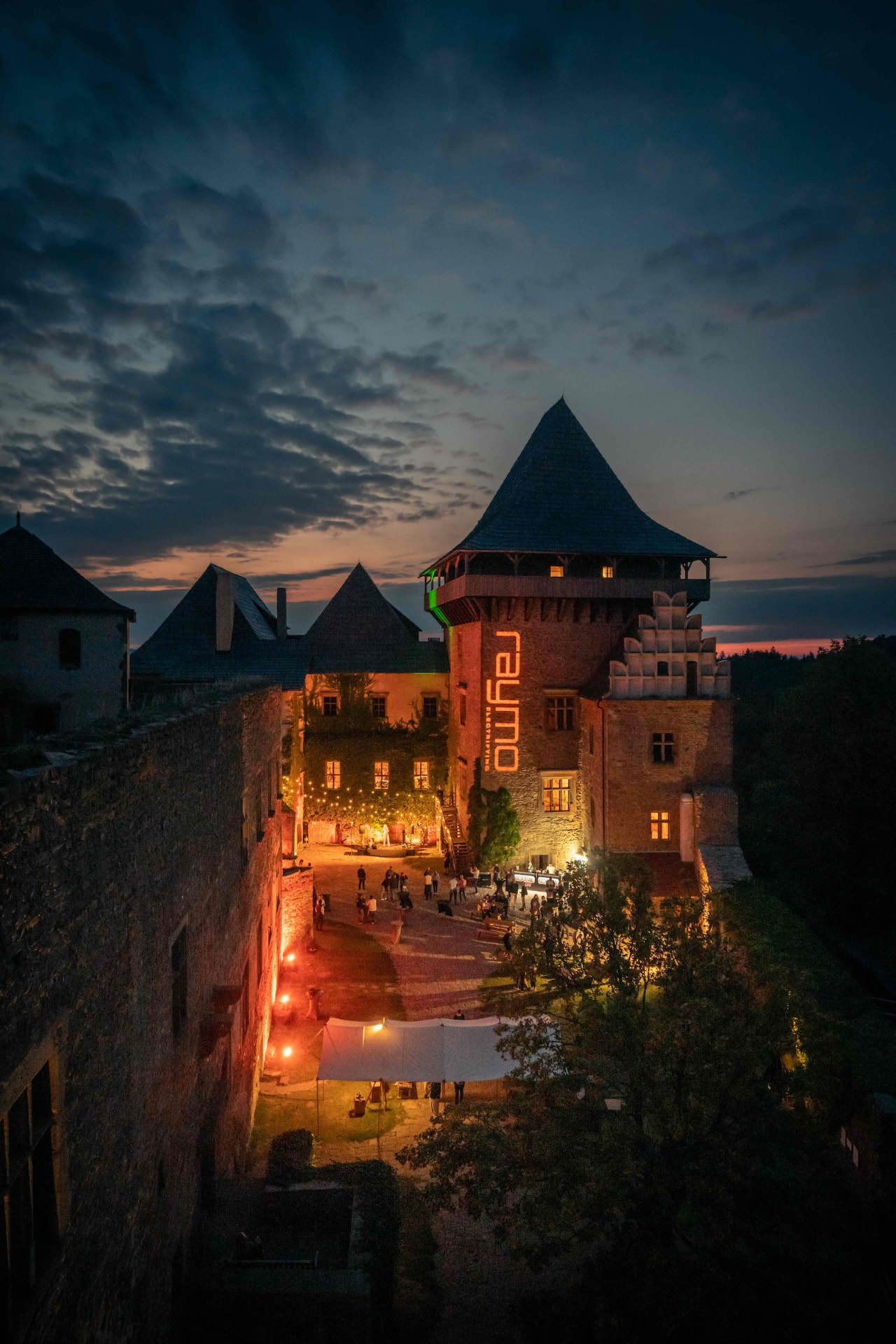 Aerial view of the illuminated castle courtyard during the gala night