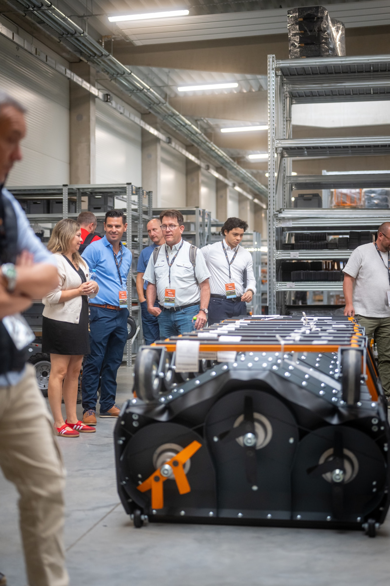 Guests looking at a large Raymo attachment during the factory tour