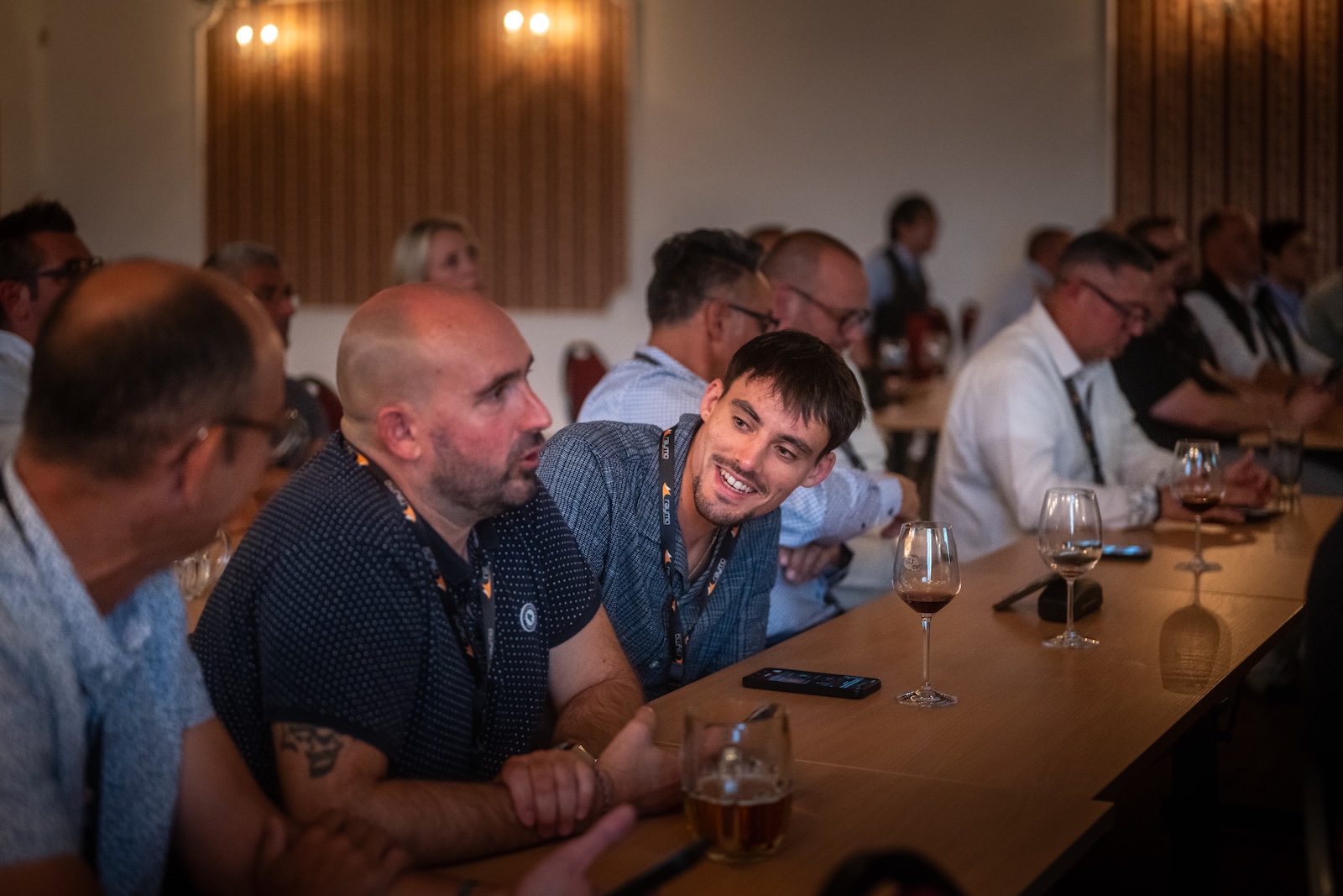 Distributors chatting over drinks at the conference tables