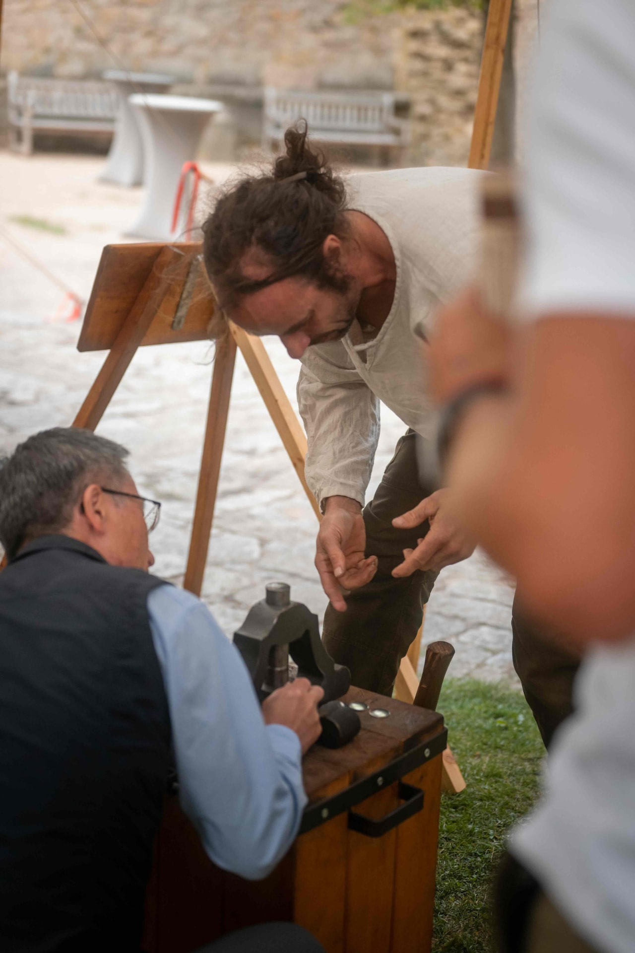 Blacksmith demonstrating traditional metalwork for the guests