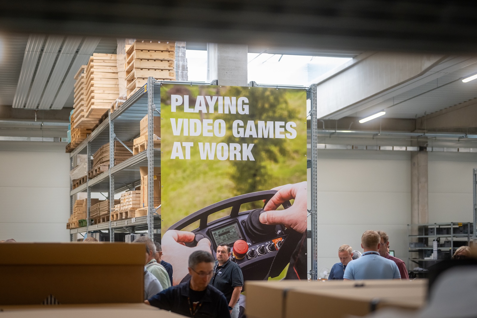 Raymo banner reading Playing video games at work in the hall