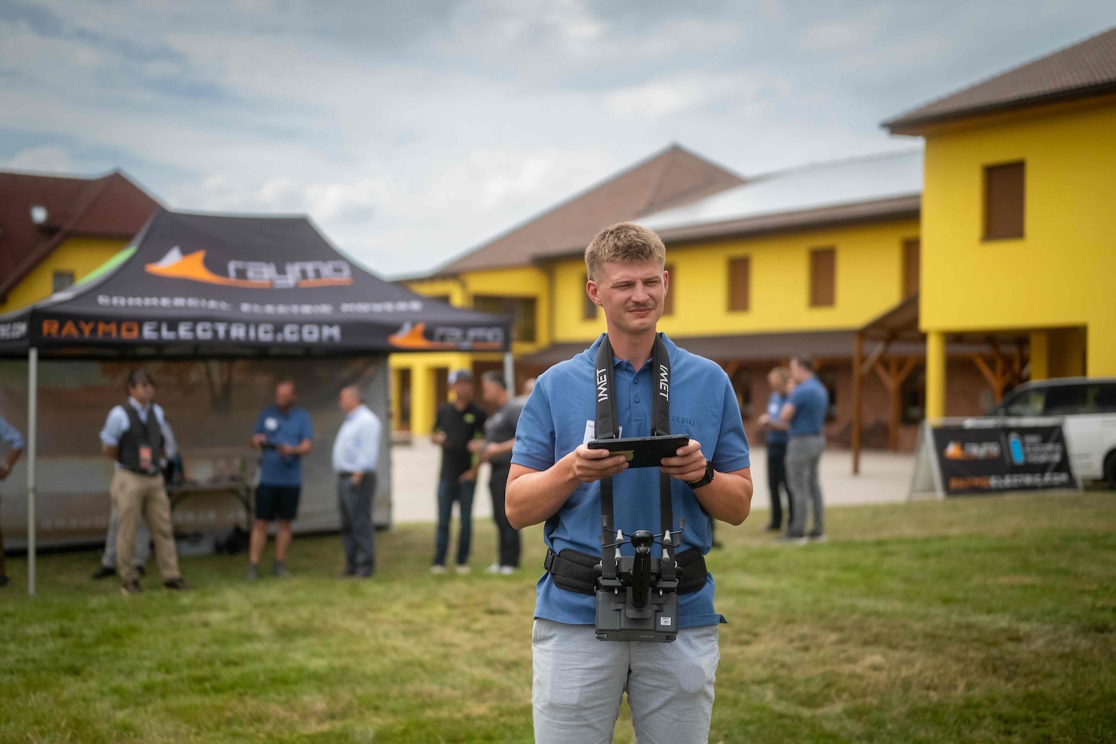 Raymo operator with a tablet controller in front of the hotel building